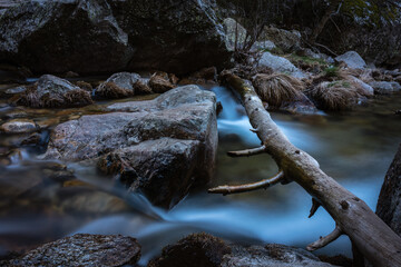 River water flows among the rocks and forms small waterfalls, Rascafría, Madrid, Spain