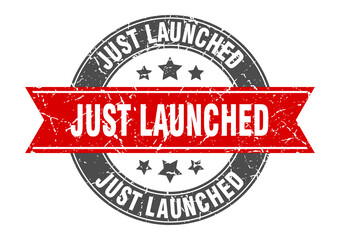 Fototapeta premium just launched round stamp with ribbon. label sign