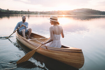 Fototapeta na wymiar Couple paddling canoe 