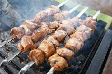 Cooking pork neck kebab on skewers