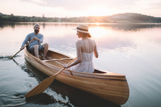 Couple paddling canoe 