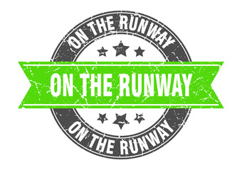 on the runway round stamp with ribbon. label sign