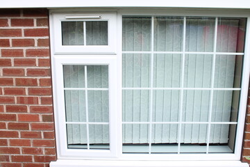 UPVC double glazed window with built in ventilation above the small window UK