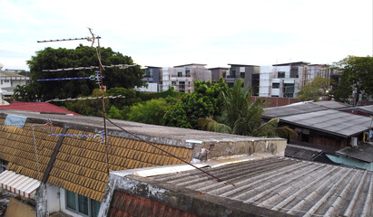 TV antenna on old roof town house .