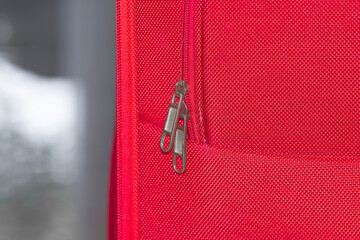 close up of zipper on red fabric