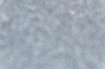 Silver abstract bokeh background, creative design. holiday decoration.