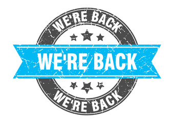 we're back round stamp with ribbon. label sign