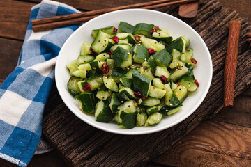 fresh cucumber salad with chilli on wood