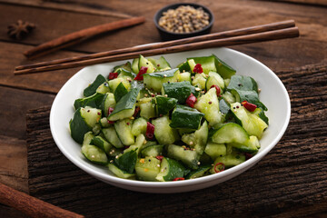 fresh cucumber salad with chilli on wood