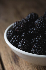 Fresh blackberries in a bowl close-up