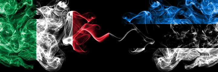 Italy vs Estonia, Estonian smoky mystic flags placed side by side. Thick colored silky abstract smoke flags of Italian and Estonia, Estonian