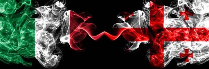 Italy vs Georgia, Georgian smoky mystic flags placed side by side. Thick colored silky abstract smoke flags of Italian and Georgia, Georgian