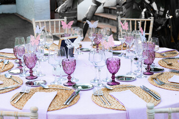 fairy pink and white table set for a wedding reception 