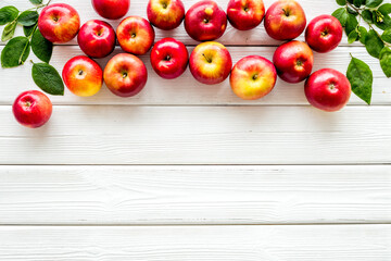 Ripe red apples with leaves - top view, copy space