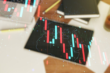 Creative concept of crisis chart illustration and modern digital tablet on background, top view. Global crisis and bankruptcy concept. Multiexposure