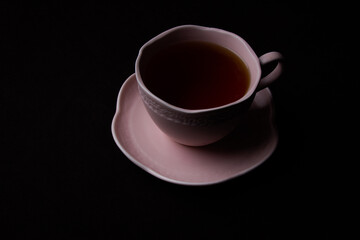 Ceramic Tea Cup on Black Background