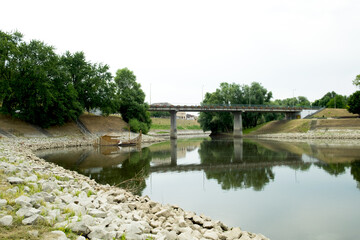 Banks of the Danube river in the city of Baja, Hungary and the pier with small fishing boats