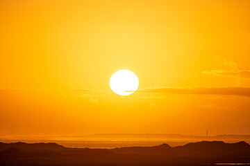 Sunrise in the beautiful protected nature area Het Oerd on the Wadden island of Ameland in the Netherlands, beautiful golden light in the early morning
