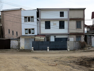 landslide caused by torrential rains of hurricane CHRISTIE. Broken road asphalt cracked, and came down with landslide. Destroyed residential buildings of cottage town elite settlement. earthquake