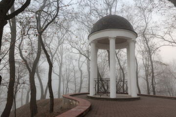 White arbor in the fog in the fall. Gomel, Belarus