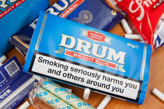 Moscow, Russia - September 17, 2020: Package of Drum Bright Blue rolling tobacco and smoking accessories