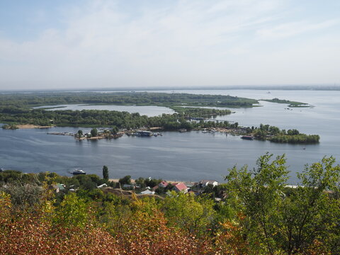 Picturesque panoramic view from the height on the touristic part of the Volga river near Saratov city at summer sunny day.Beautiful natural landscape.Central part of Russia.Europe.