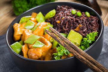 Thai red curry with chicken and black rice.