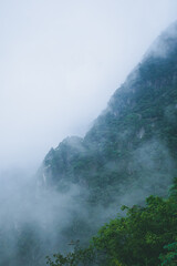 Mountain landscape covered in clouds and fog on Wugong Mountain in Jiangxi, China