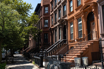 Row of Old Brownstone Homes in Bedford-Stuyvesant in Brooklyn of New York City along an Empty...