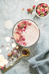 Obraz na płótnie Canvas Pink matcha latte with milk. Trendy beverage. Christmas drink