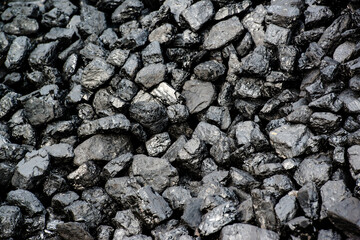 A pile of black coal from mining pit - background