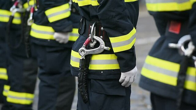 Fire fighters uniform detail with carabiner and harness during ceremony 