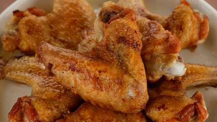 fried chicken wings close up rotating