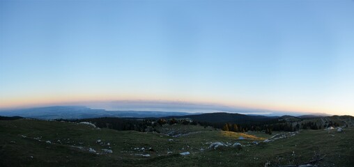 Panorama of the evening mood on Monte Tendre with a view of the swiss alps and a view of lake geneva