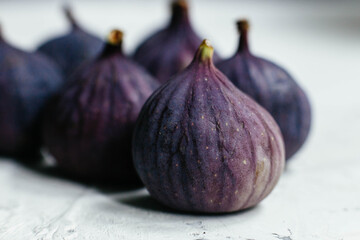 Ripe figs on white background