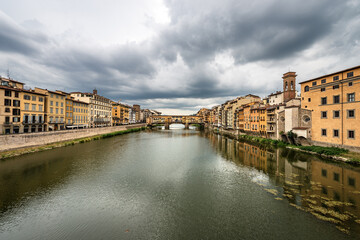 Fototapeta na wymiar Florence cityscape with the famous Ponte Vecchio (Old Bridge) and the River Arno, view from the bridge of Santa Trinita. Tuscany Italy, Europe