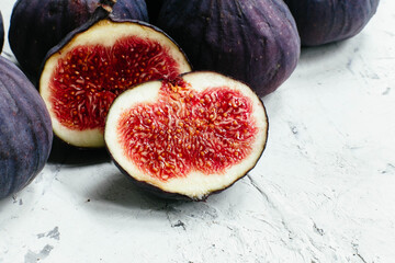 Ripe cut figs on a light background