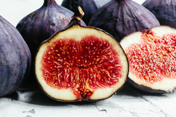 Ripe cut figs on a light background