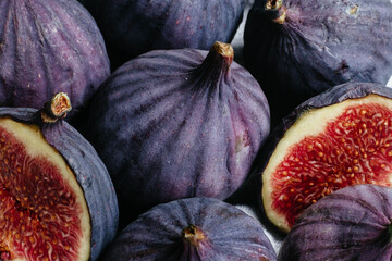 Ripe cut figs on a light background