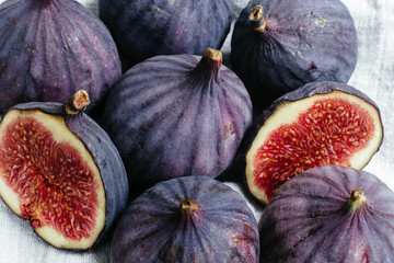 Ripe cut figs on a light background