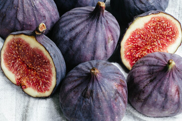 Ripe cut figs on a light background
