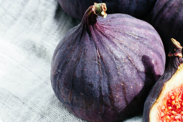 Ripe cut figs on a light background