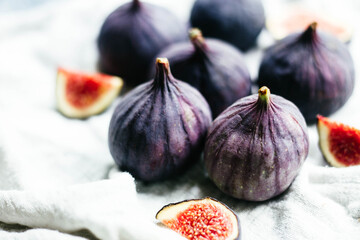 Ripe cut figs on a light background
