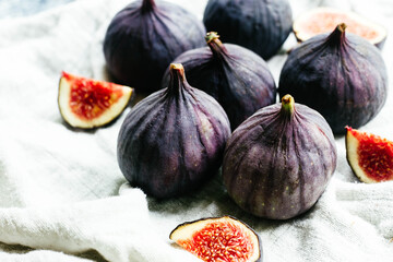 Ripe cut figs on a light background