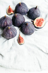 Ripe cut figs on a light background