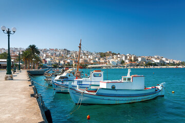 Fototapeta na wymiar Sitia, Crete, Greece; August 27, 2020 - Seaport of Sitia town with moored traditional Greek fishing boats, Crete, Greece.