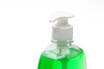 Green liquid soap bottle on white background