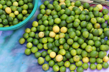 Lime fruits sold in an Asian street market stall