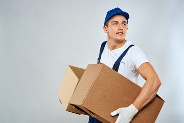 working man in uniform with boxes in his hands delivery loader lifestyle