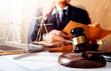 Business and lawyers discussing contract papers with brass scale on desk in office. Law, legal...